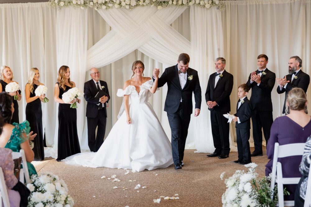 The farm golf club wedding with soft white flowers and black tie celebration