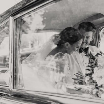 bride and groom wedding photos in antique rolls royce from Hardwick